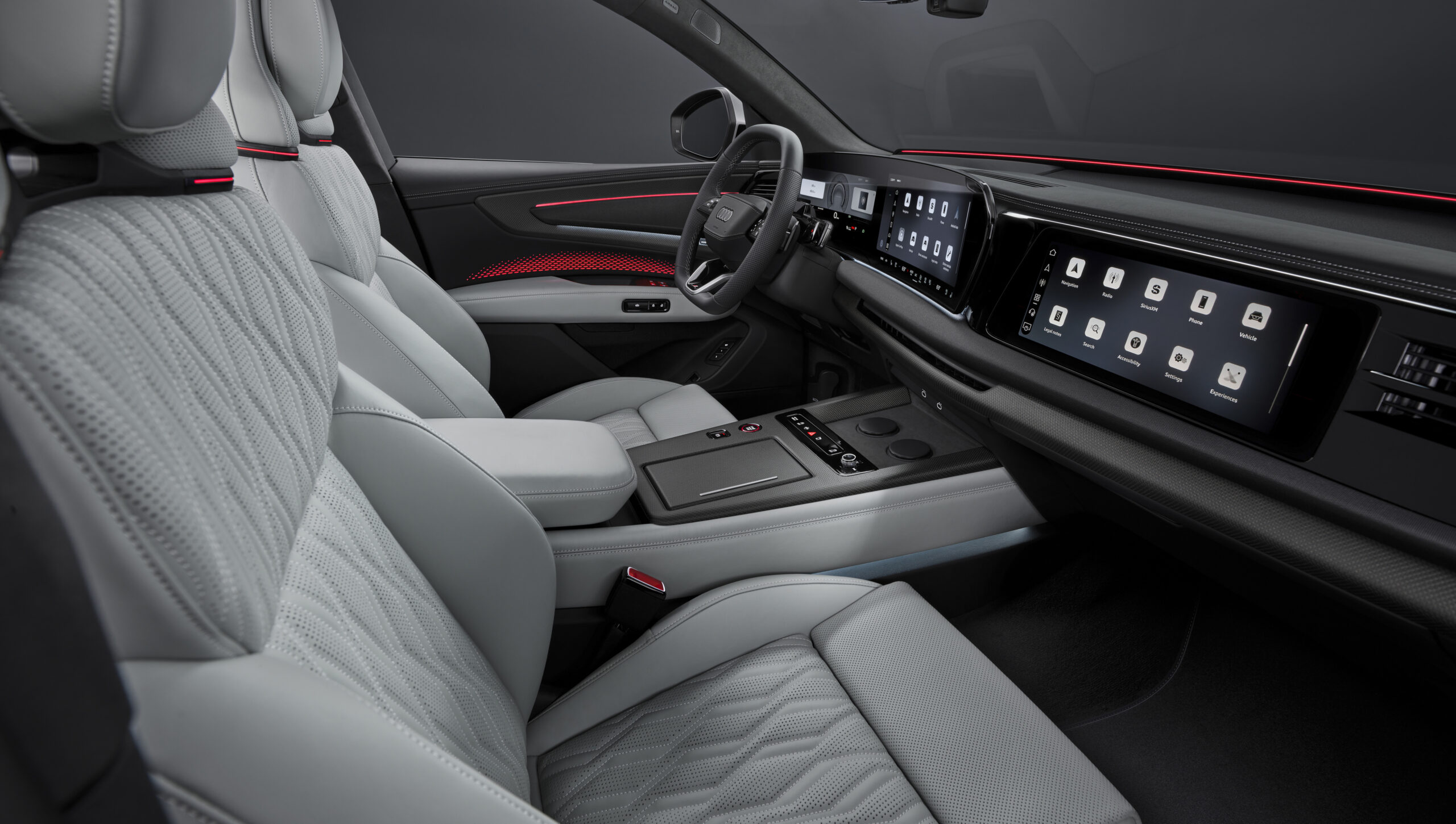 Audi SQ9 esisalong vaates kaassõitja poolt koos digitaalsete ekraanide ja helgete nahkistmetega